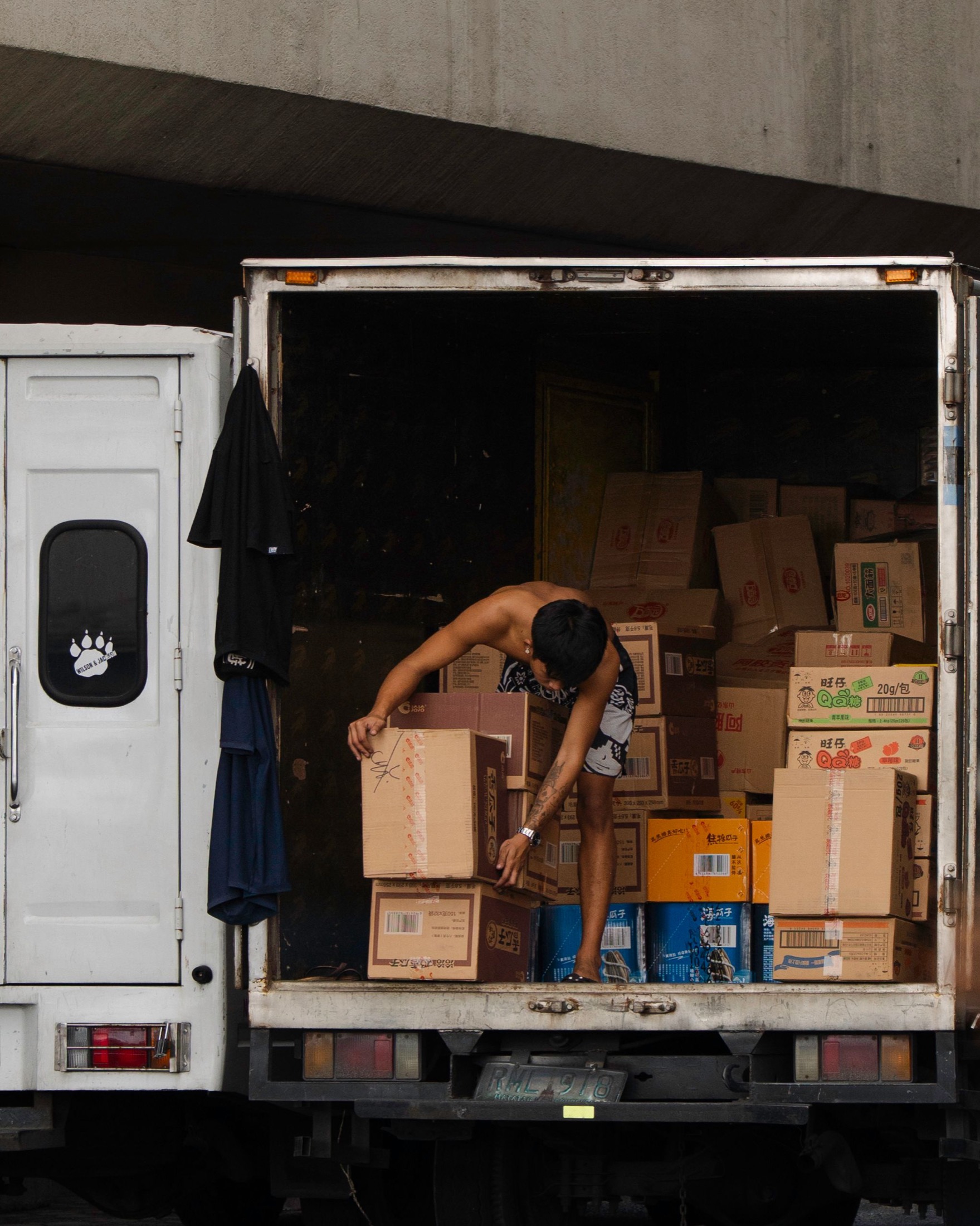 Cartons being handled from a supply truck